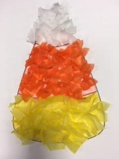candy corn made of white, orange and yellow tissue paper squares.