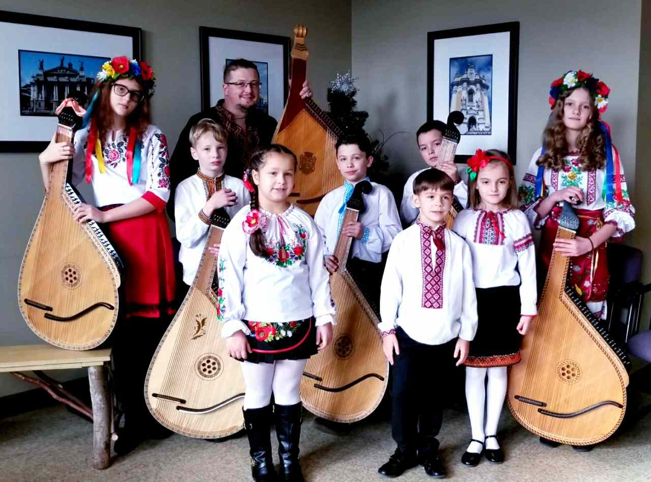 Photo of Ukrainian Musicians in traditional outfits holding their instruments