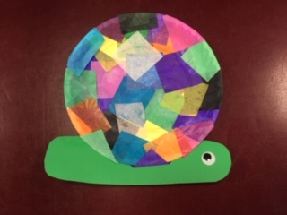 green snail with colored paper collage shell 