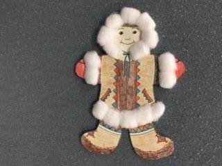 Inuit wearing outwear trimmed with cotton ball trim