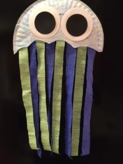 paper jellyfish with large eyes and colored paper strip tentacles