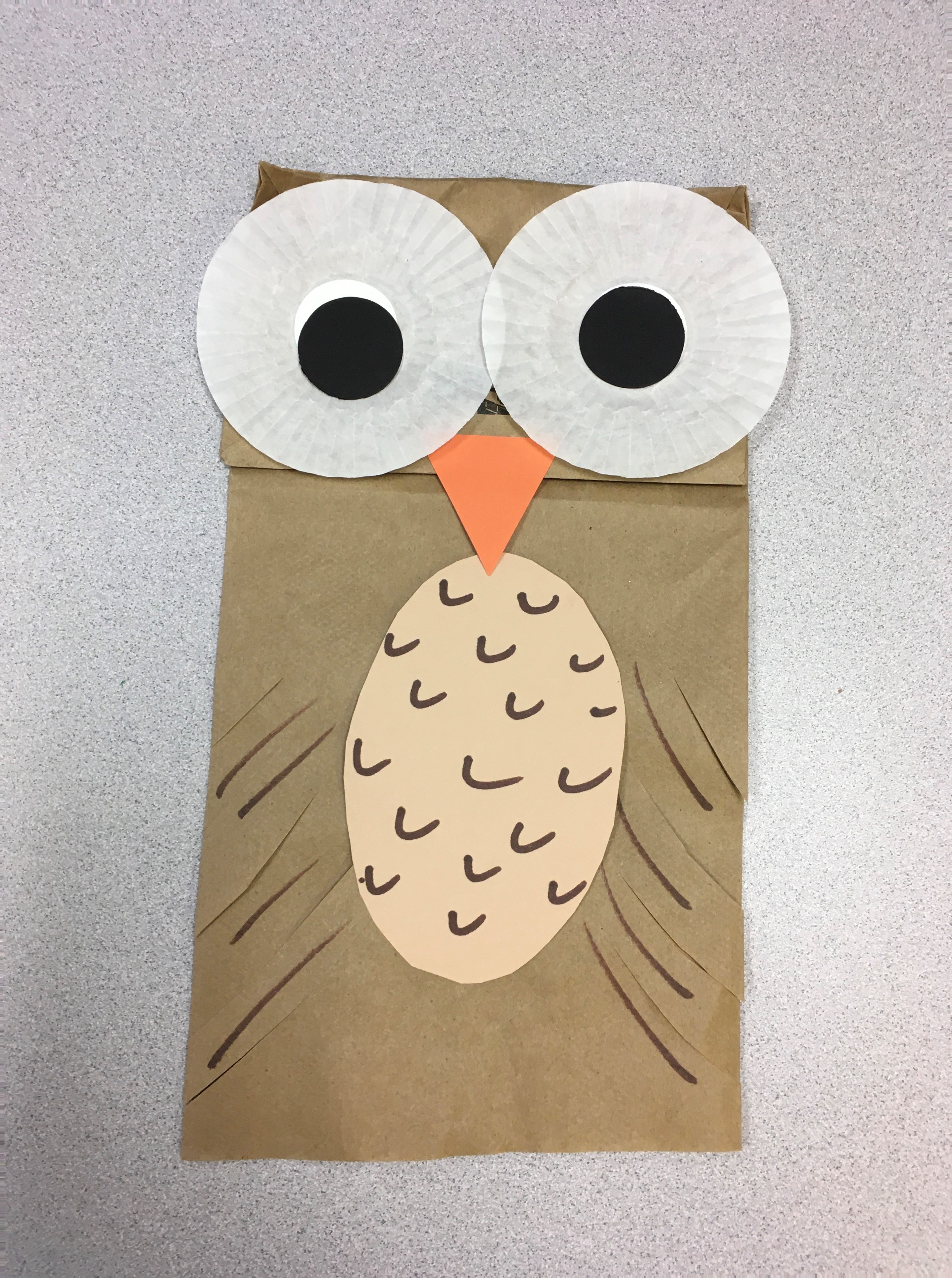 paper bag owl puppet with white baking cup eyes