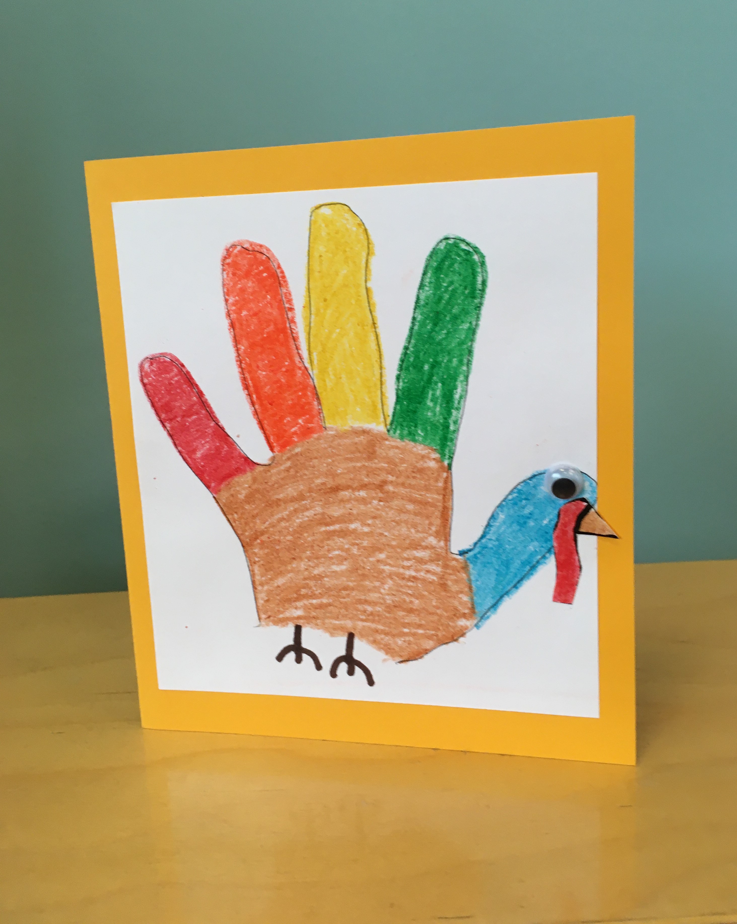 handprint outline turkey on gold cardstock - greeting card