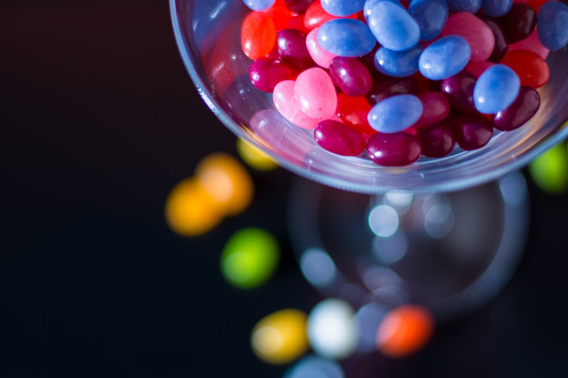 Jar of jellybeans tilted over