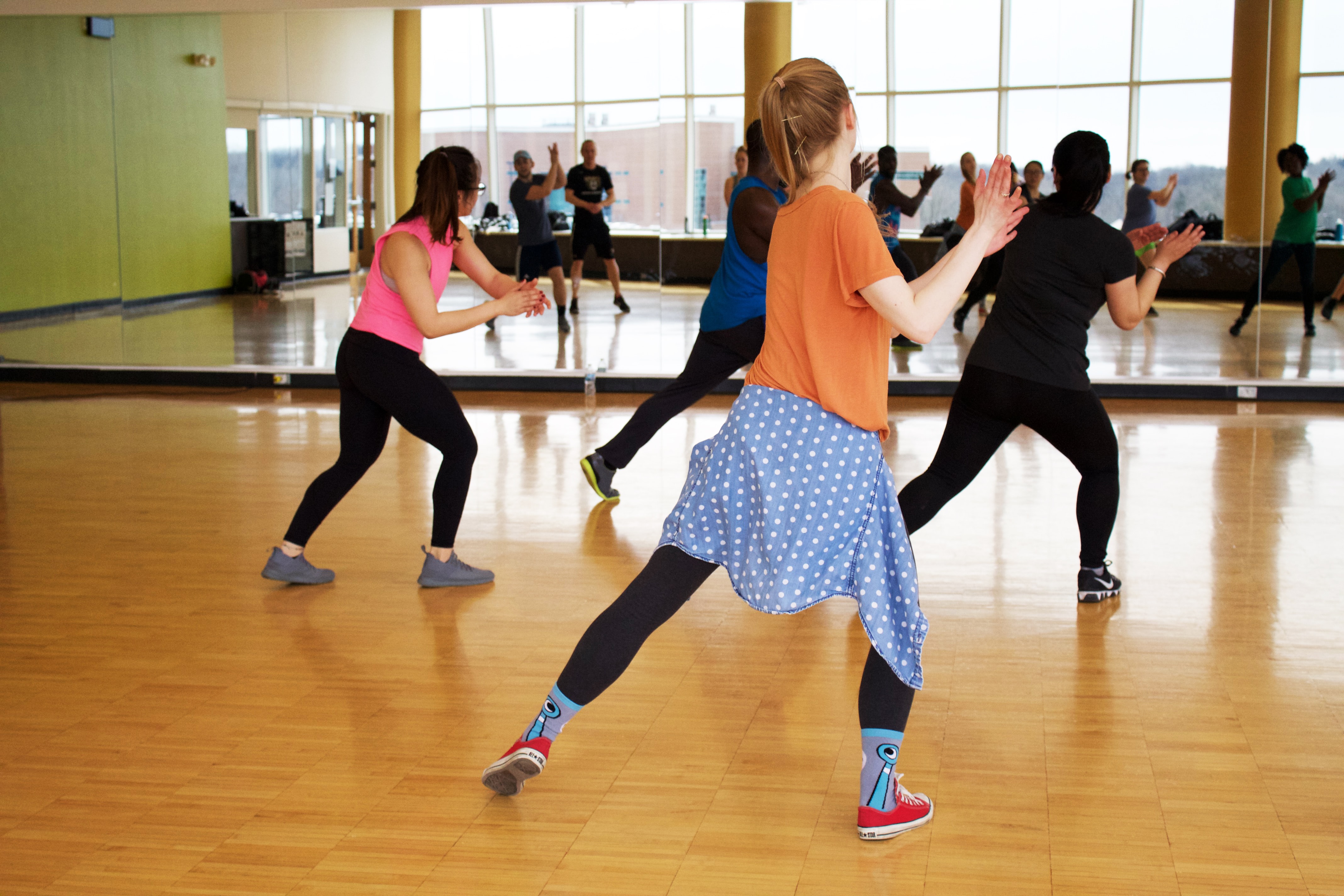 People dancing in a mirrored dance std=udio