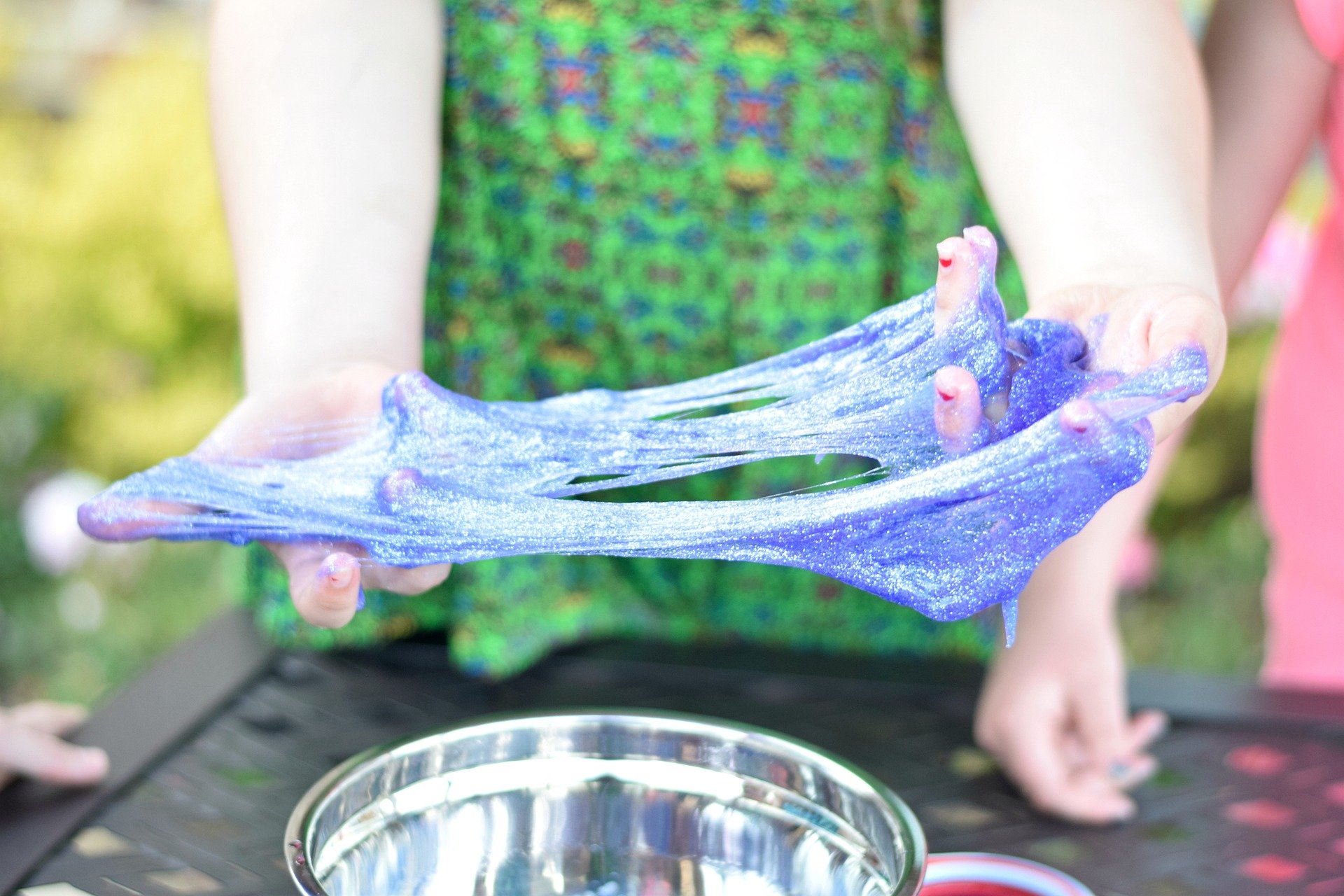 a child pulling on slime