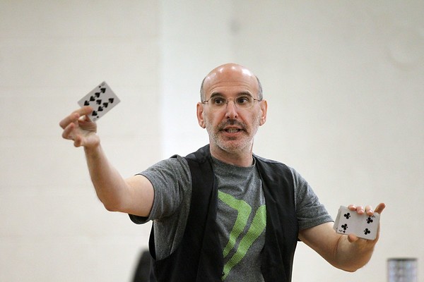 Magician Gary Kantor holding a card