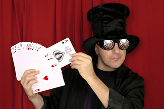 Magician by the name of the Great Boodini holding a large deck of cards