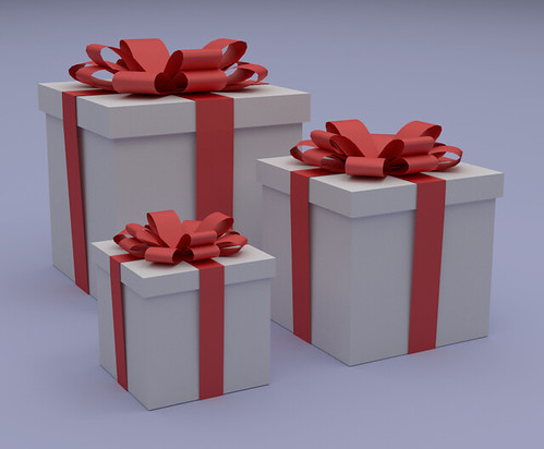 image of gifts in white boxes with red bows.