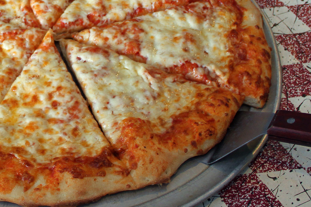 image of cheese pizza on metal tray