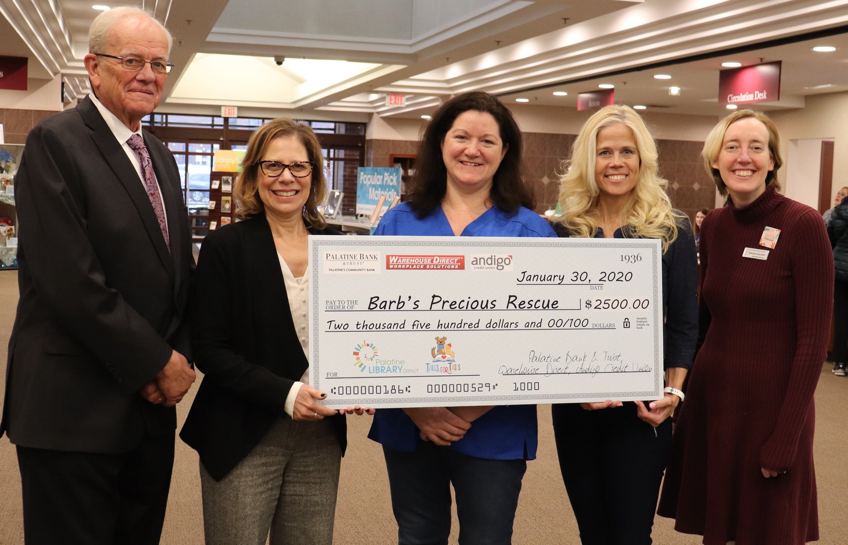 Partners presenting Barbs Precious Rescue a Check