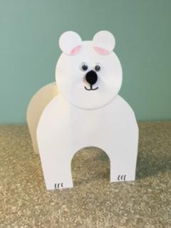 white polar bear with wiggle eyes and black pom pom nose