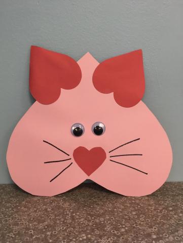 heart-shaped cat face with red heart ears and nose, wiggle eyes and whiskers