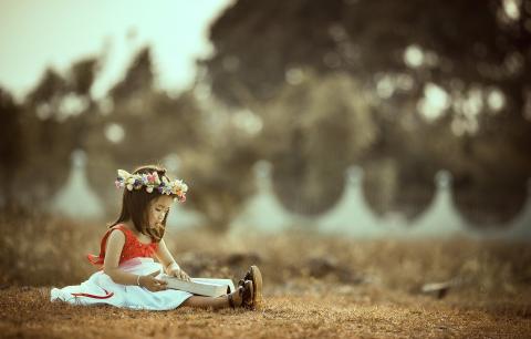 girl reading outdoors