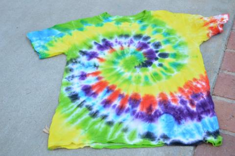 photo of a brightly tie-dyed t-shirt.