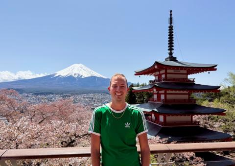 Picutre of Brian Michalski on a overlook by a Japanese Temple