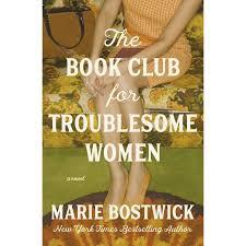 The cover shows a woman from the chest down seated on a vintage floral couch, her hands folded over her crossed legs. The title “The Book Club for Troublesome Women” appears in large white text across the center, with the author’s name, Marie Bostwick, across the bottom.