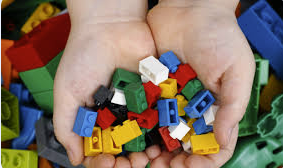 lego bricks in hands